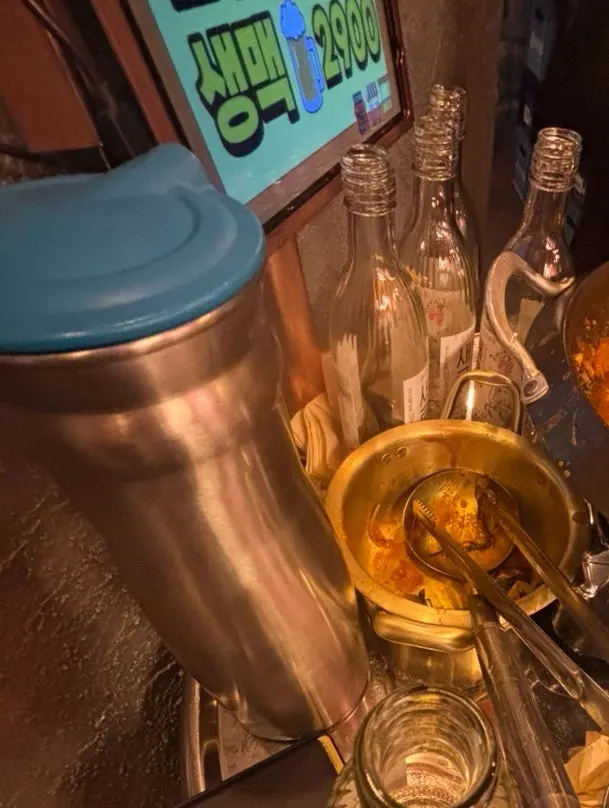 Table with 5 soju bottles and a final draft beer