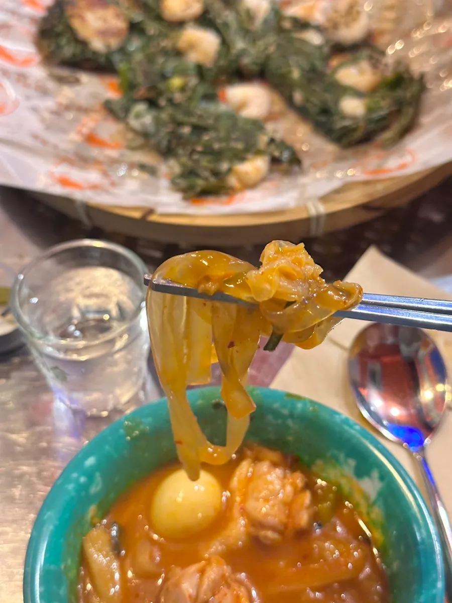 Chicken and glass noodles scooped onto a plate