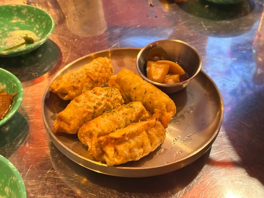 Scallion pancake cut into bite-sized pieces with scissors