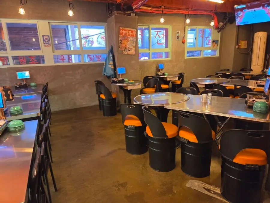TV screen inside the bar showing a live sports broadcast