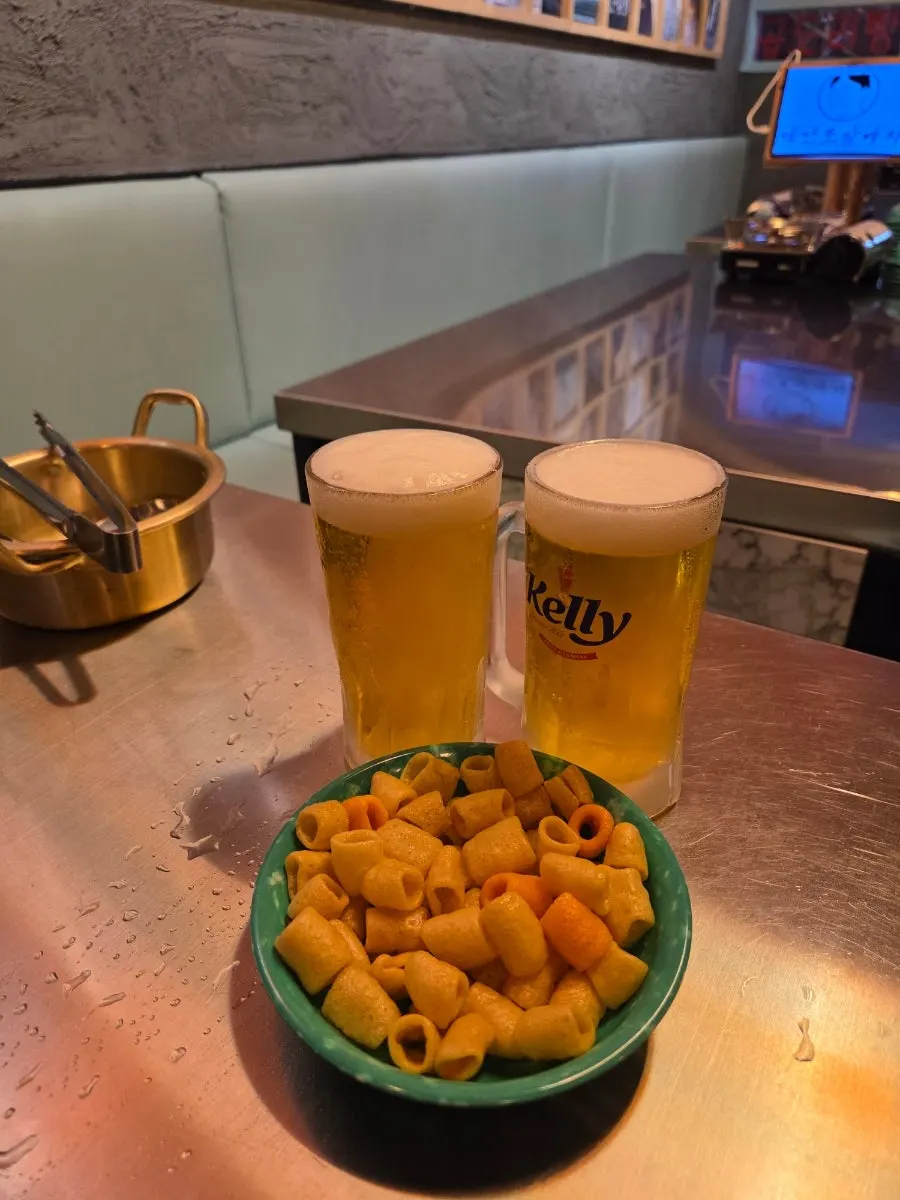 Icy draft beer served in a glass frozen down to the handle