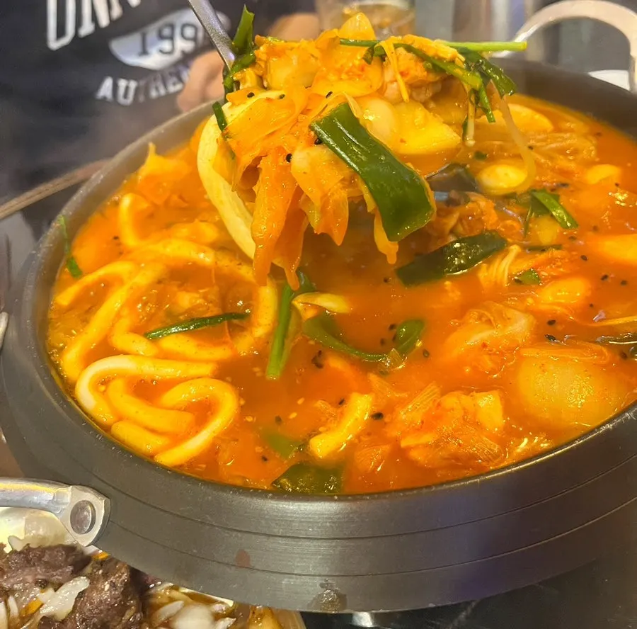 Dakdoritang broth with various noodle and side additions