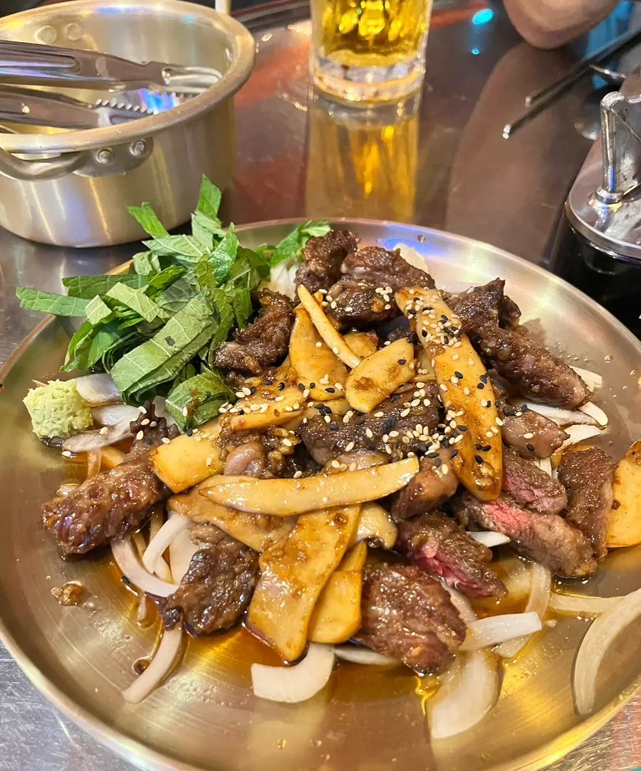 A bowl of dakdoritang with all the sides