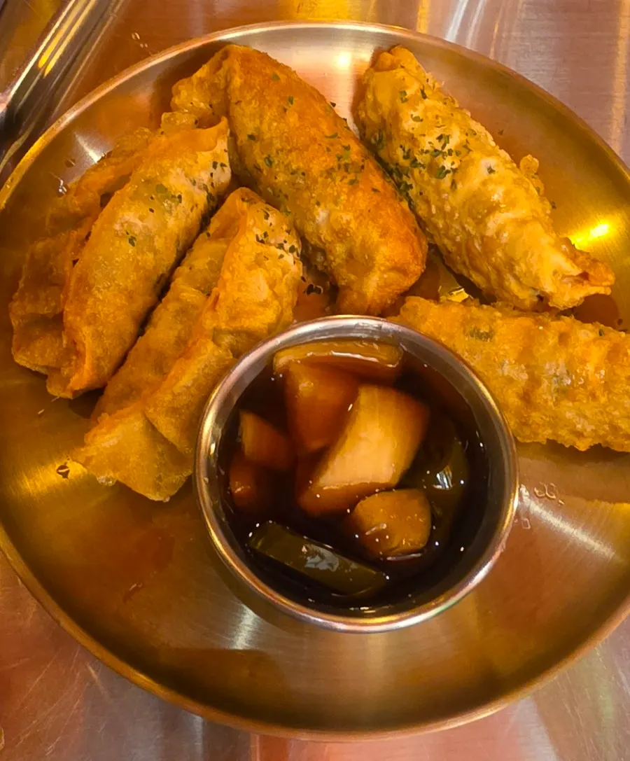 Wang mandu served with soy sauce