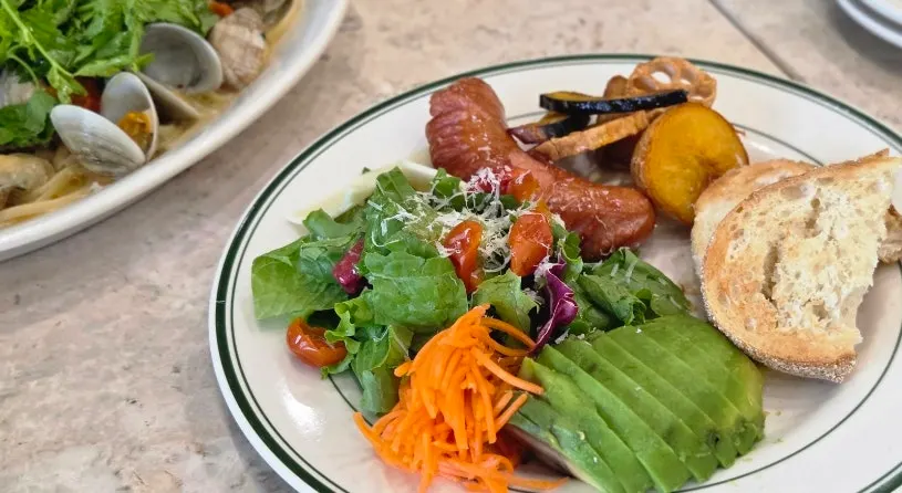 Signature brunch plate with sourdough and roasted vegetables