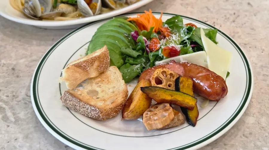 Brunch plate with avocado, emmental cheese, and carrot rapée