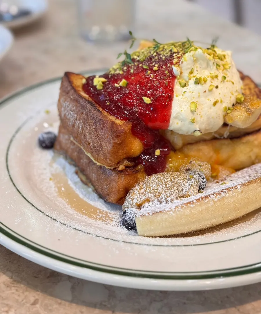 Close-up of banana brûlée toast drizzled with syrup