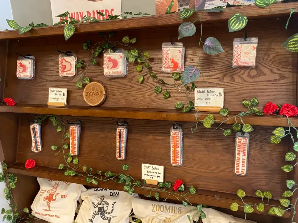 Small goods display with phone grips and pens