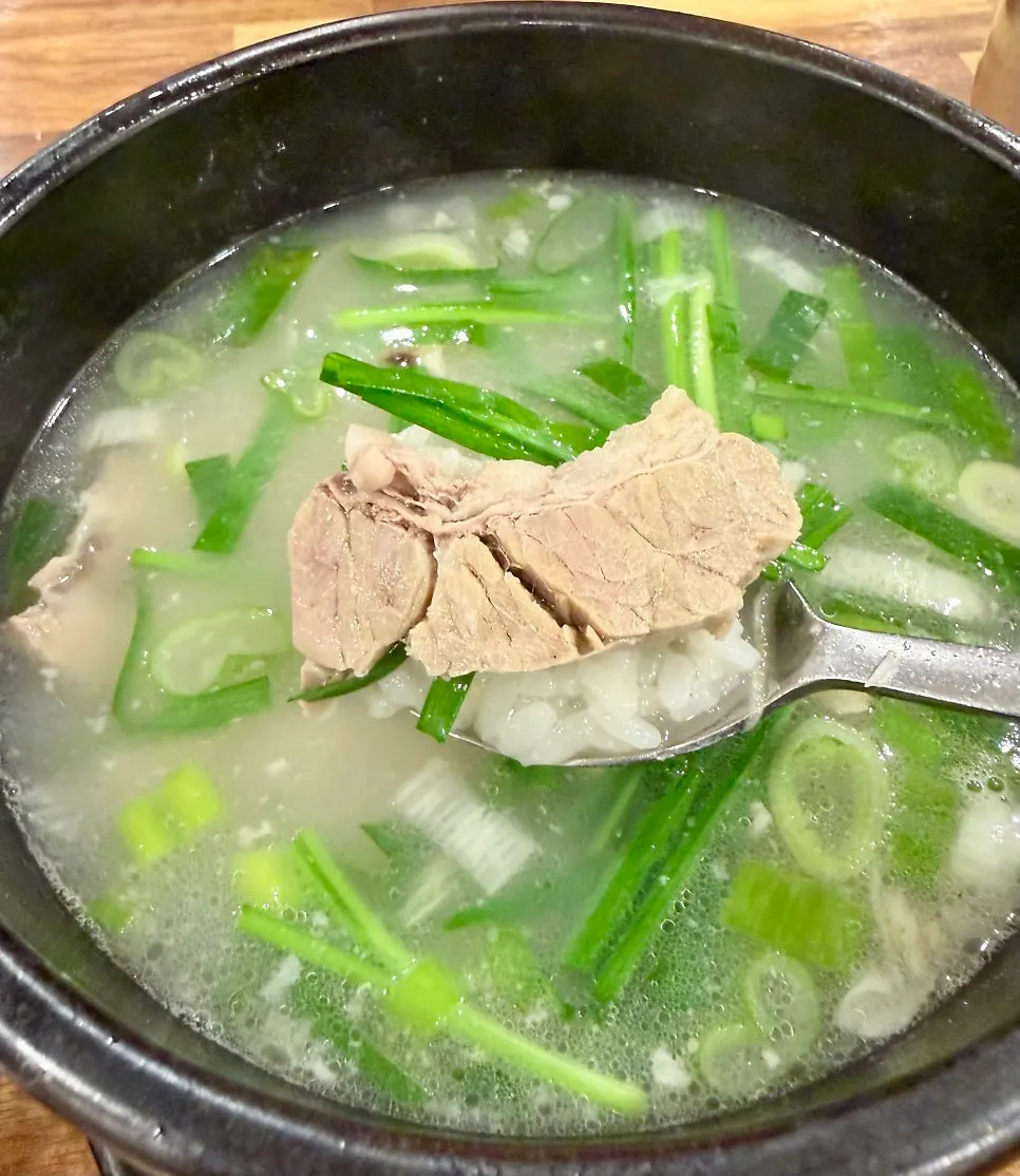 Spoonful of dwaeji gukbap pork and chives