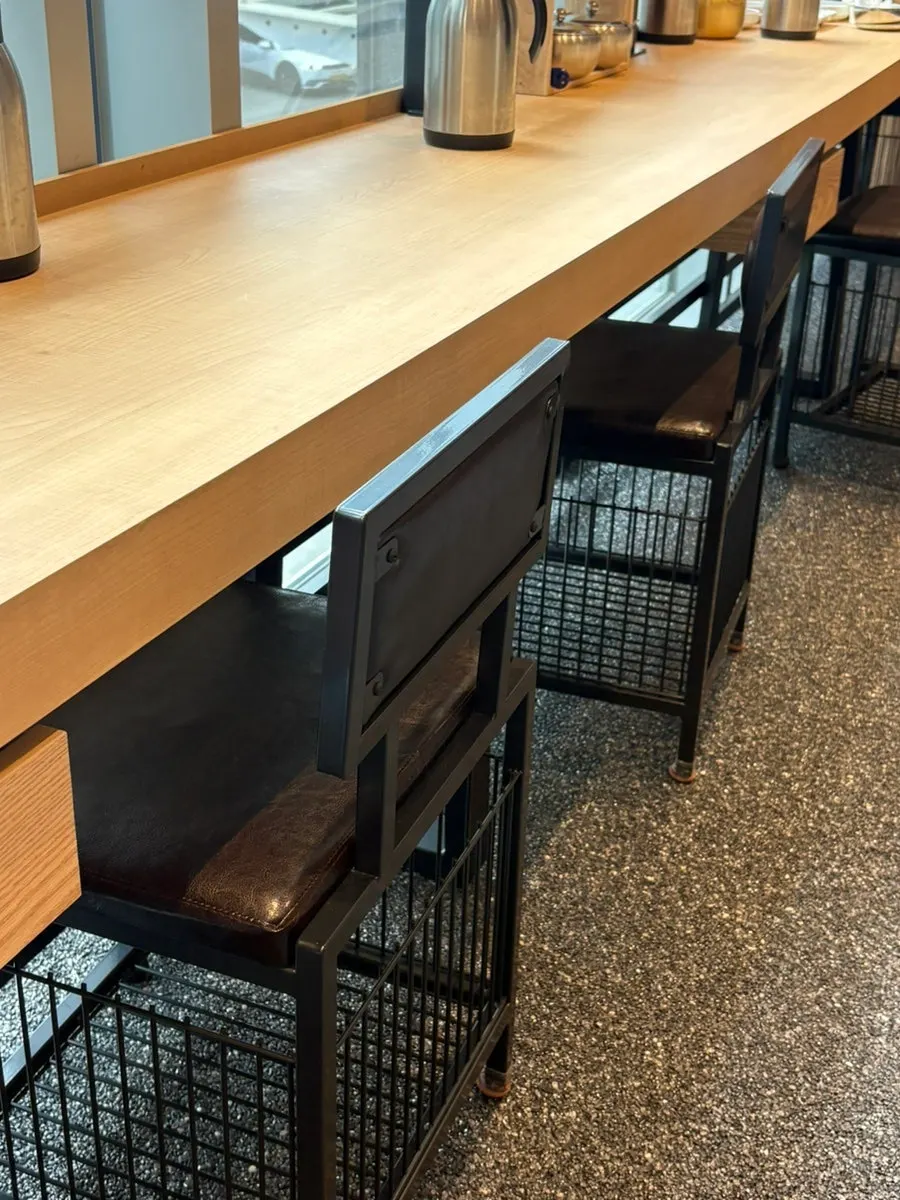 Paper cups, water, and condiments set on the table