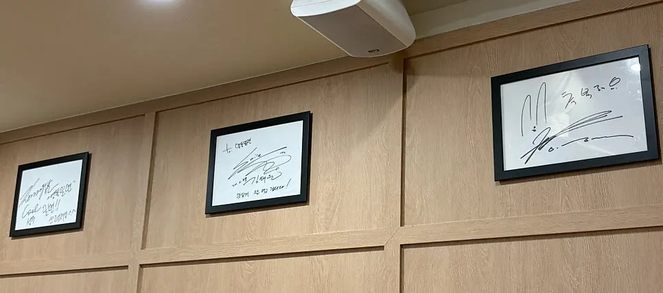 Wide view of the autograph wall