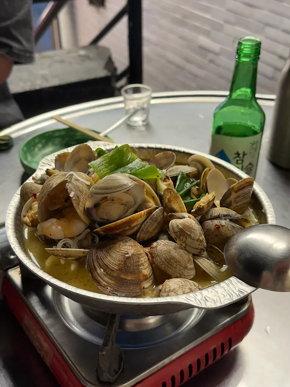 Vongole soju stew filled with clams and shrimp