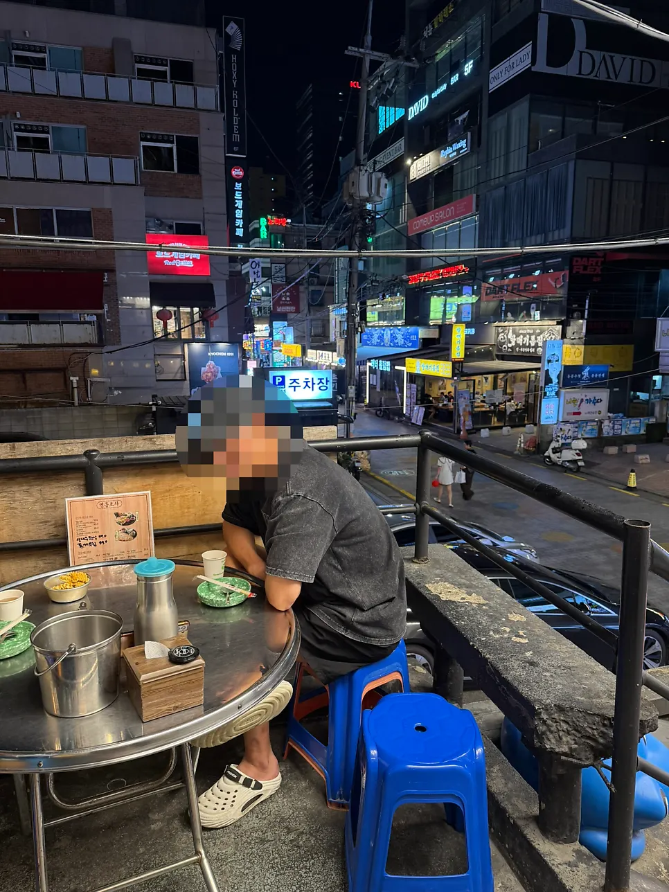 Outdoor seat overlooking the restaurant alley