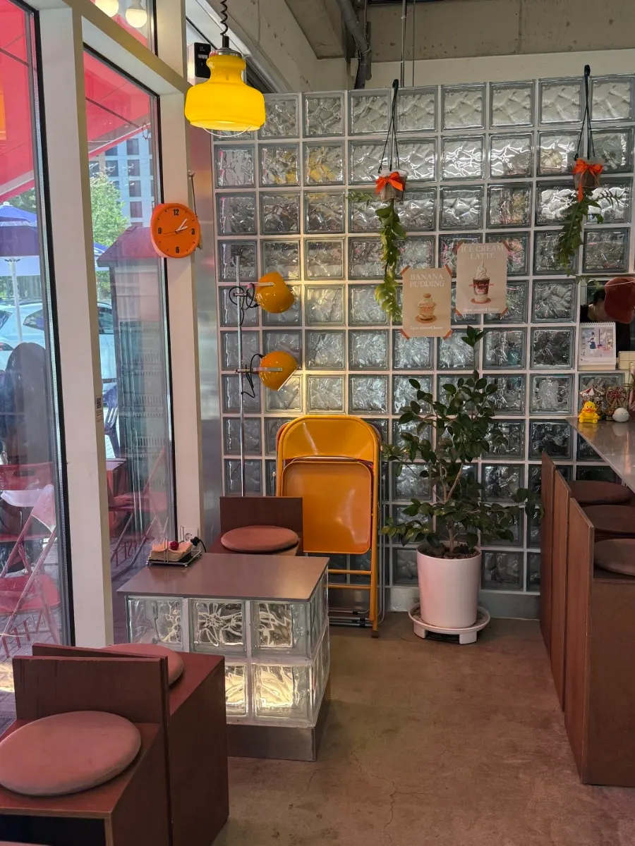 View of outdoor tables in front of the café