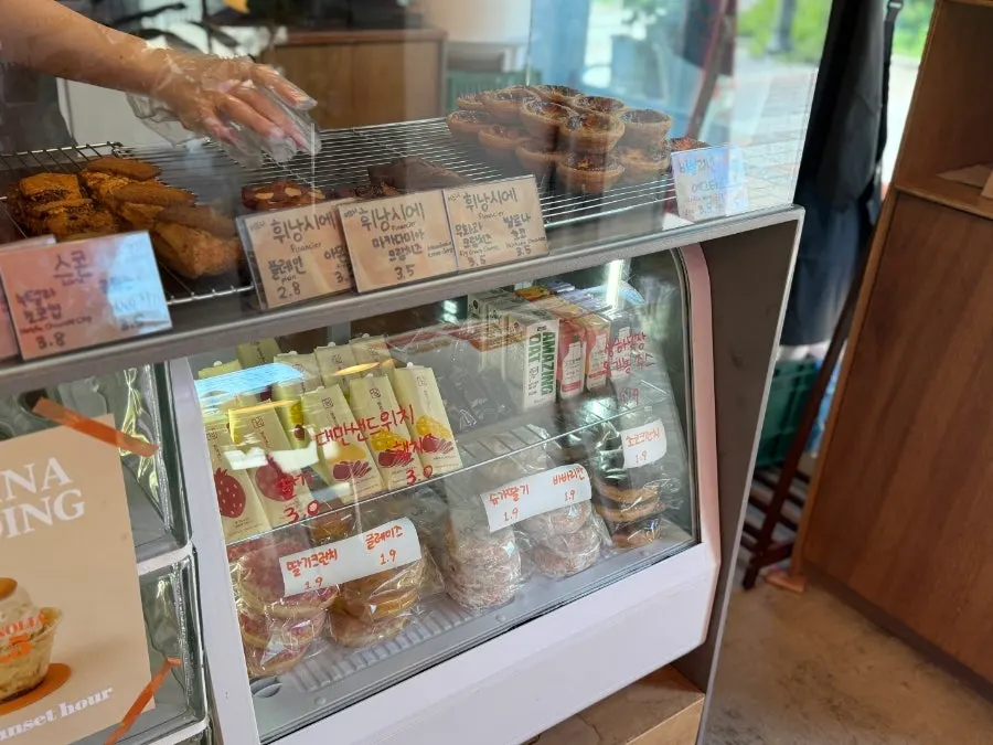 Bread display case with bagels and donuts