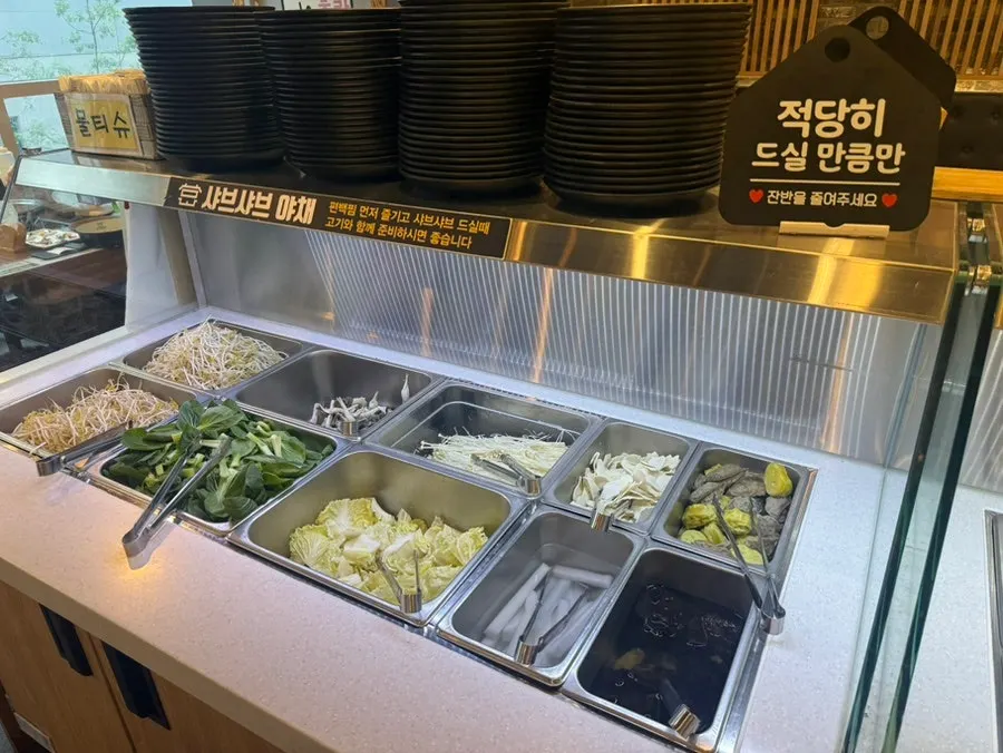 Side dishes laid out at the salad bar
