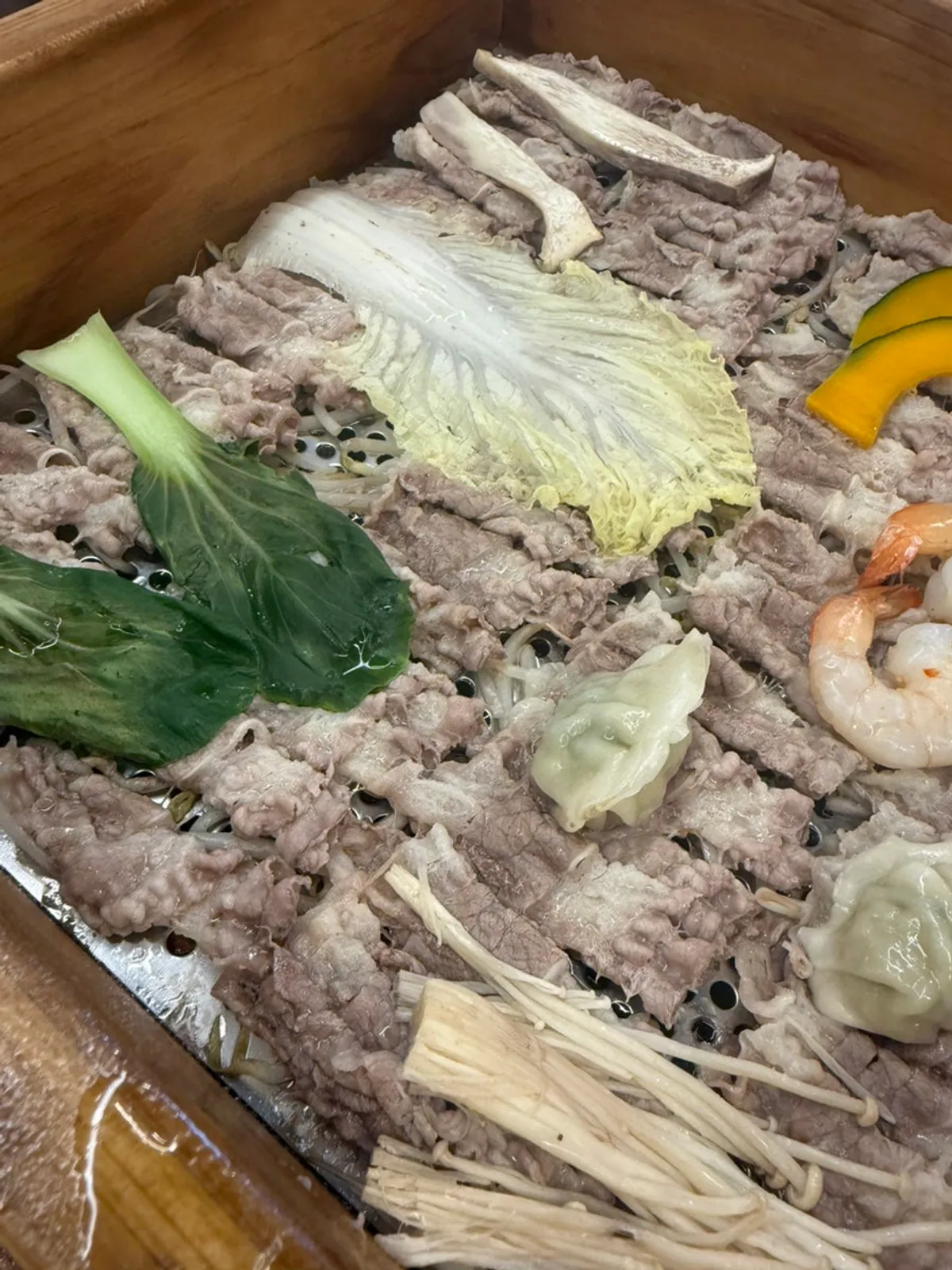 Moist, well-cooked cypress-steamed meat and vegetables