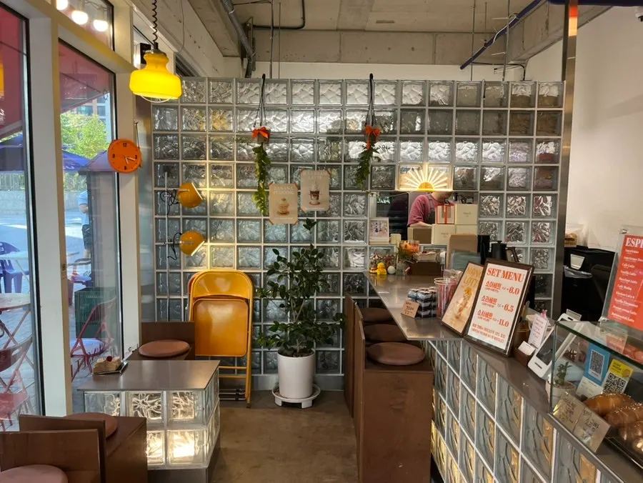 Café interior with glass blocks and orange-colored accents