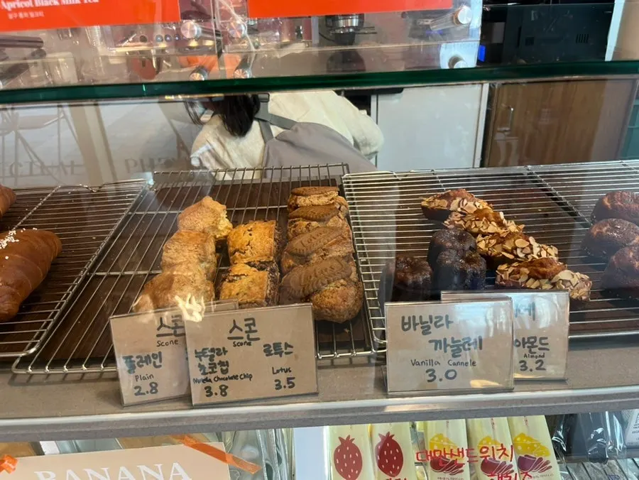 Display case with scones and bagels