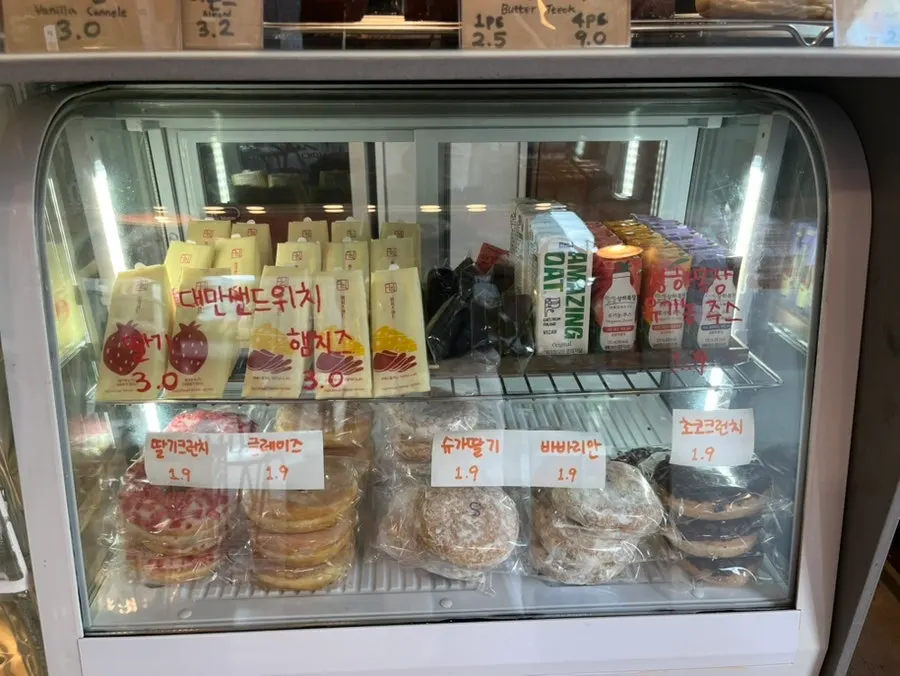 Bakery display case with sandwiches