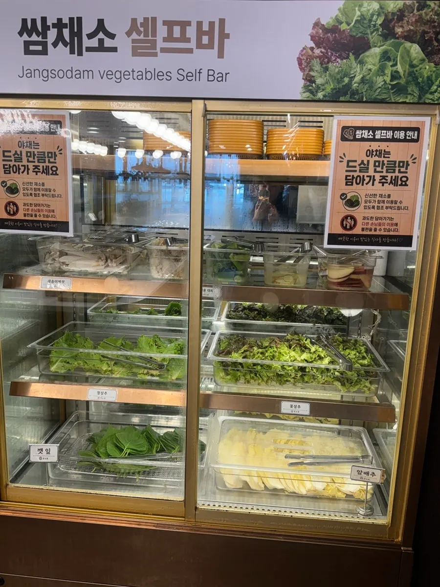 Trays of tteokgalbi and meat at the self-bar