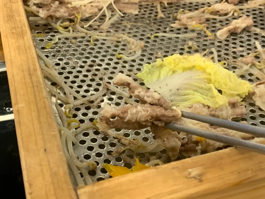 Cypress-steamed food with peanut sauce