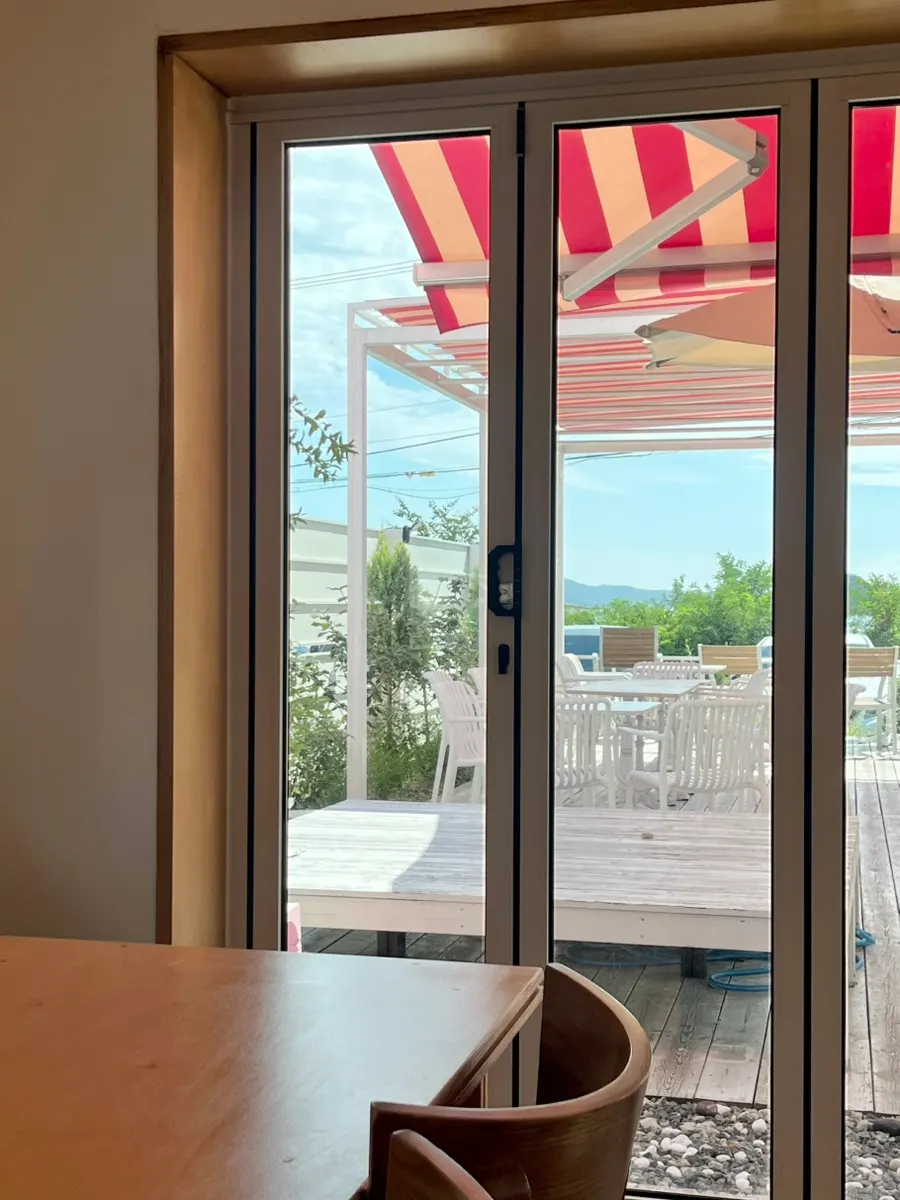 Coffee and indoor seating at Pink Wall Cafe