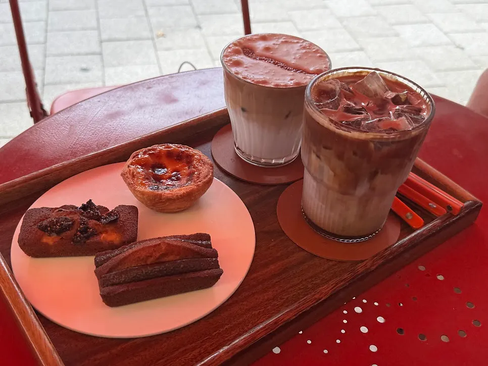 Latte and dessert set on an outdoor table