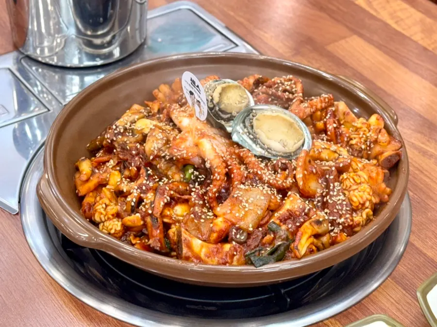 Seafood braised short ribs topped with octopus and abalone