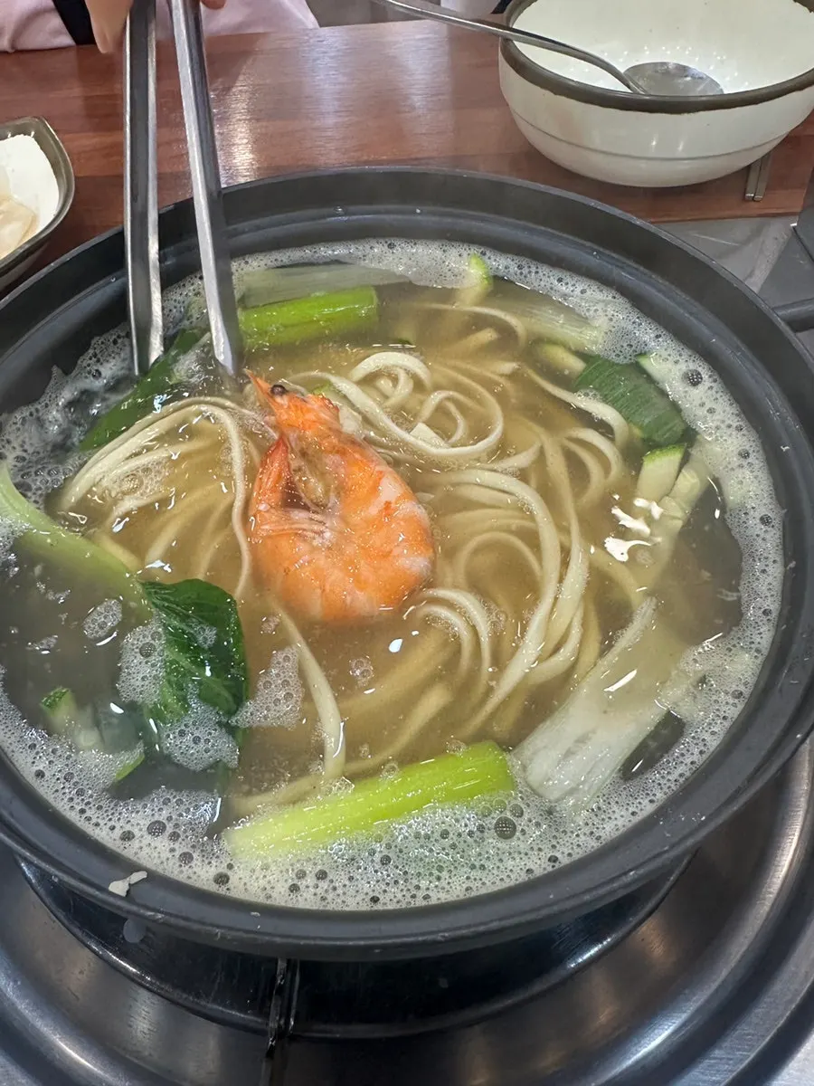 Seafood kalguksu noodle soup made with clam broth