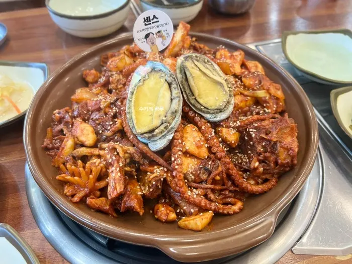 Seafood braised ribs for two topped with two whole abalones