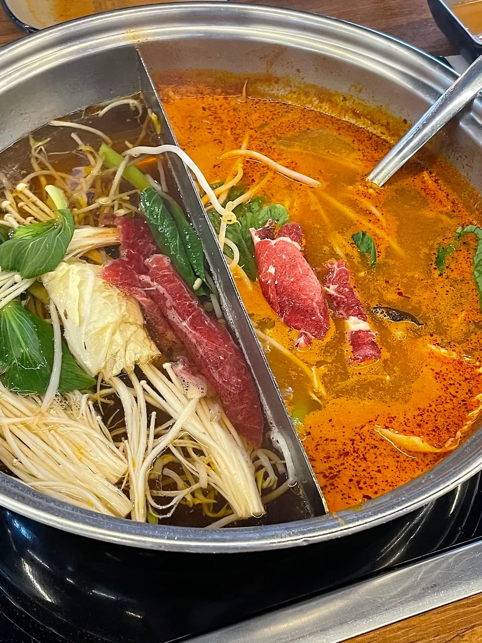 Half clear broth and half spicy broth