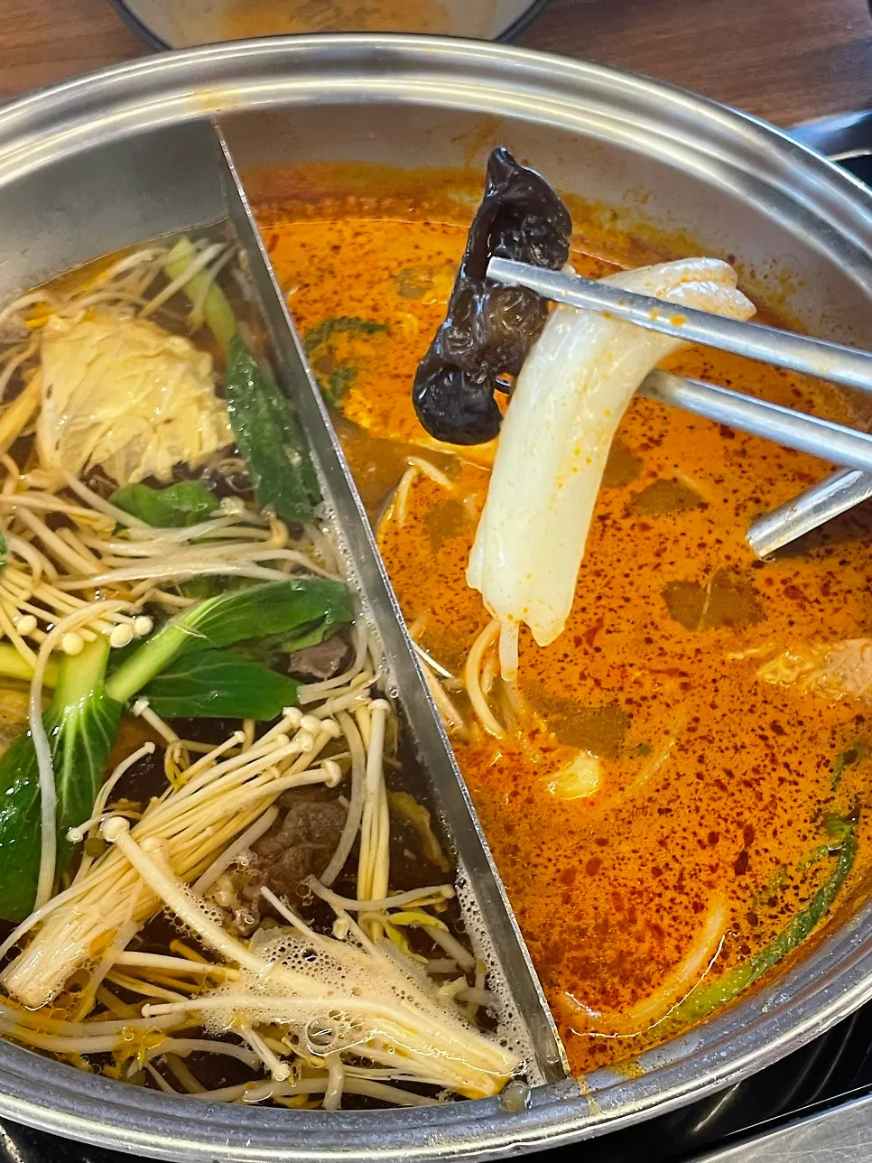 A meal of cypress steaming, rice-paper rolls, and shabu-shabu