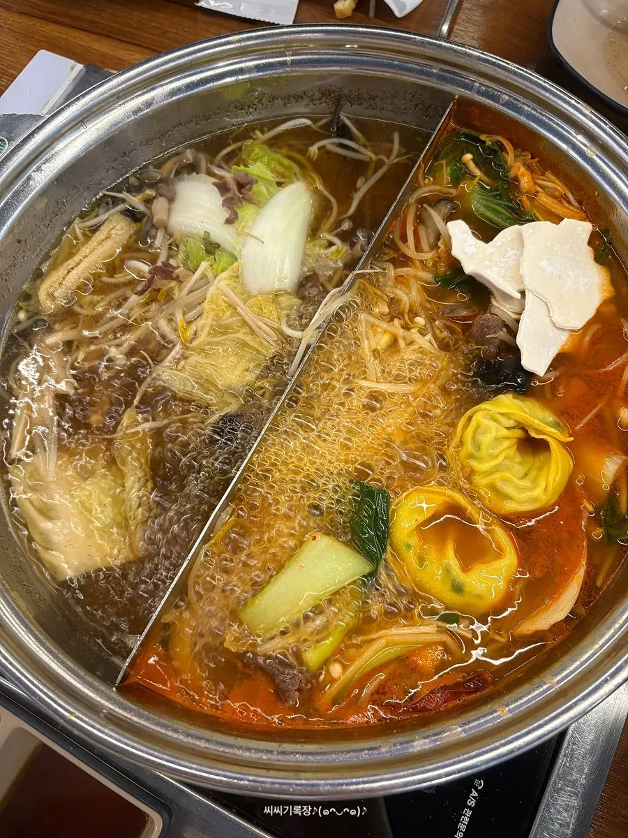 Dumplings and sujebi added into the shabu-shabu pot