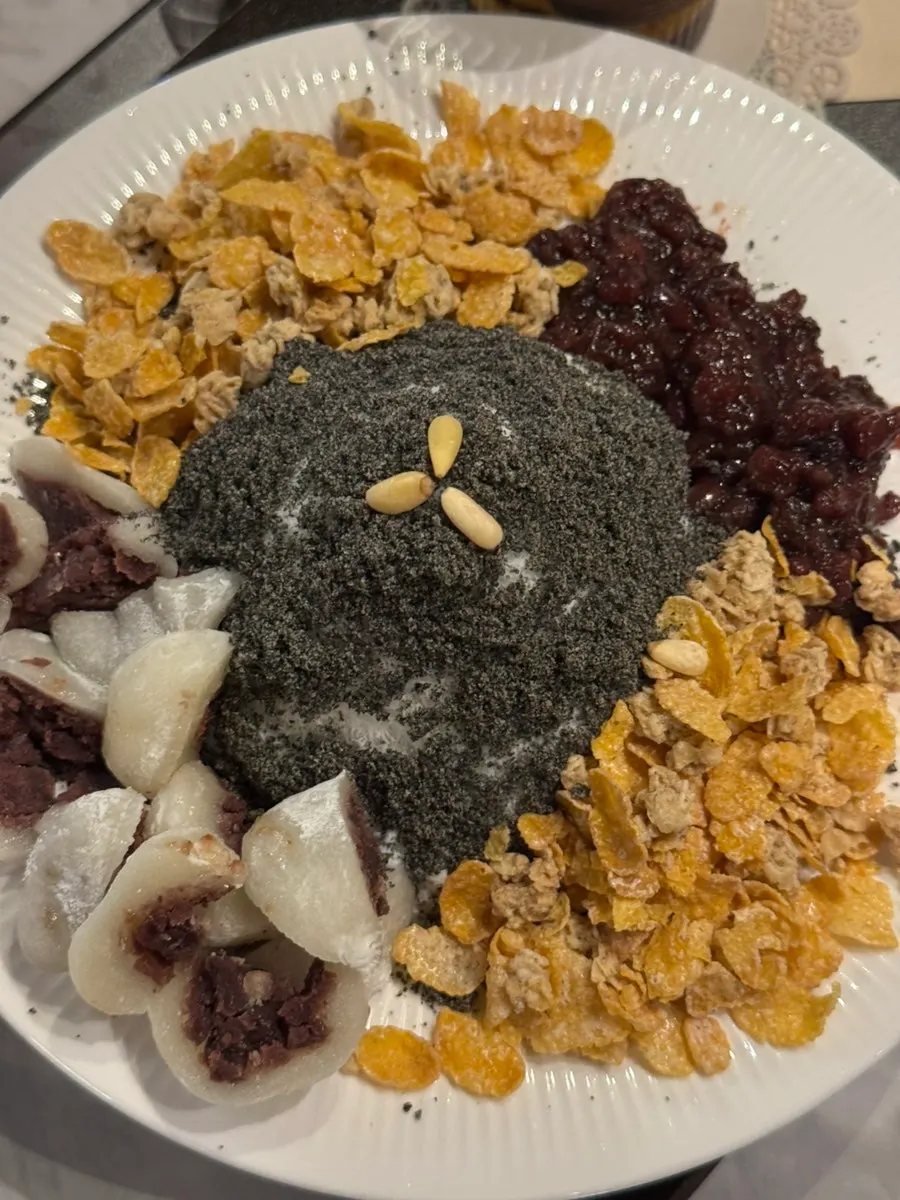 Black sesame snow bingsu piled high with black sesame