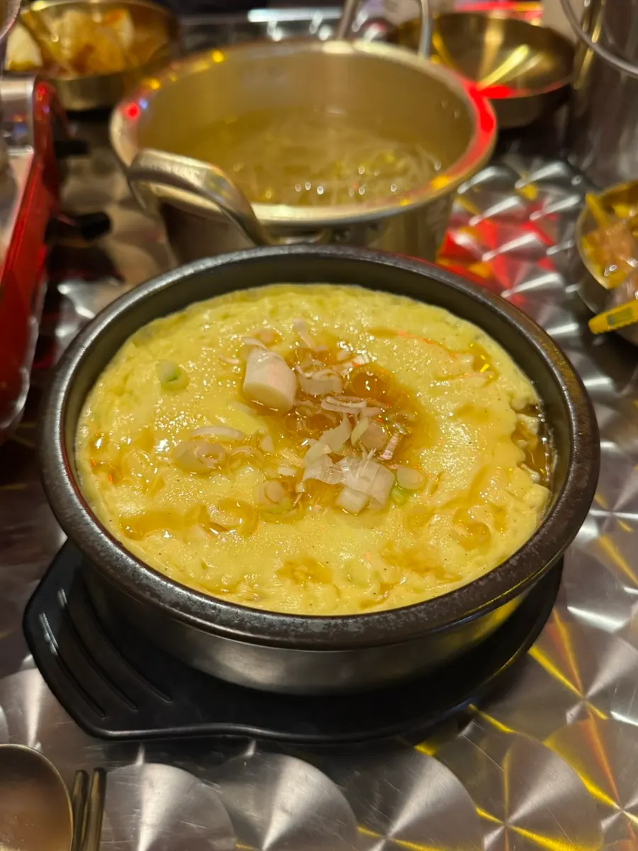 Yeongpo's egg custard puffed up over the rim of its stone pot