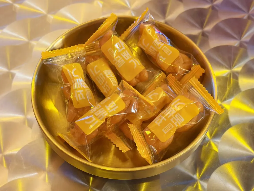 Individually wrapped gwabaegi crackers served as a basic side dish