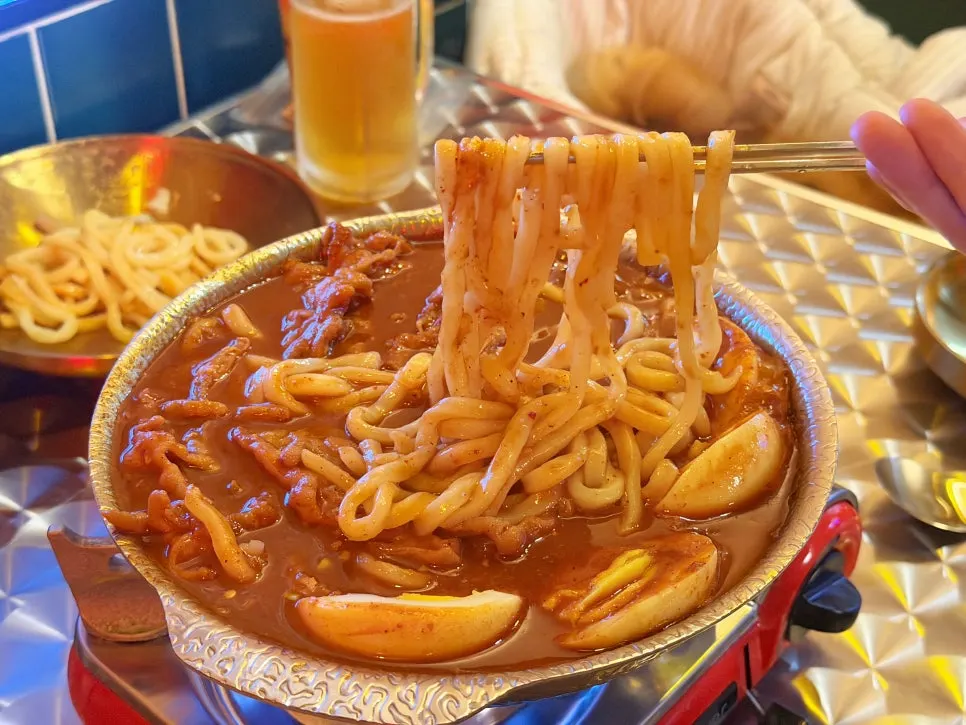 Udon noodles soaked in the spicy broth