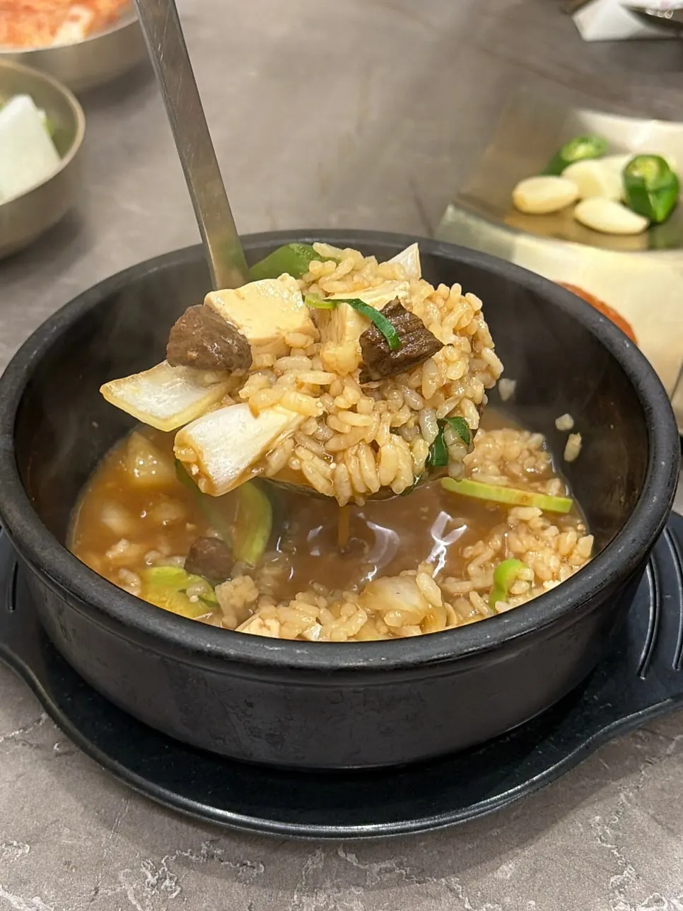 Complimentary doenjang sulbap in a stone pot