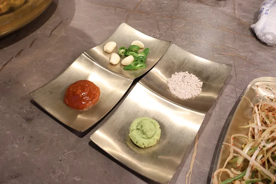 Basic setup of ssamjang, garlic, chili, wasabi, and salt