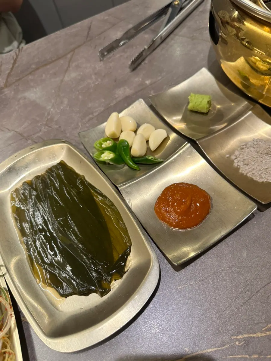 Table set with the charcoal brazier grill at Yeongpo Hwa-ro Ingye Branch