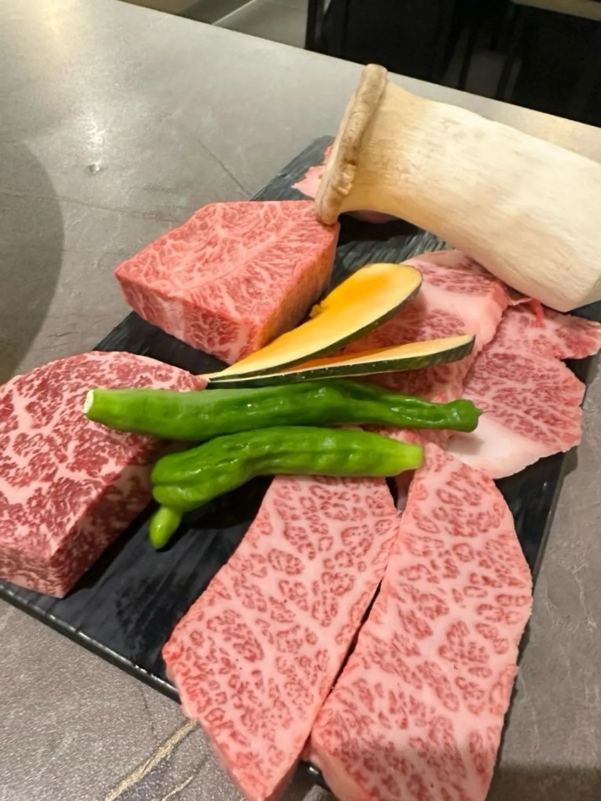 Basic side dishes including myeongyi namul and scallion salad at Yeongpo Hwa-ro