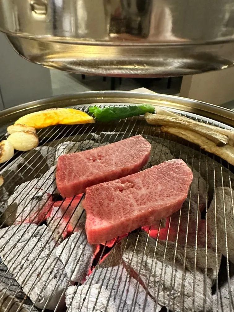 Individual hanwoo cuts being grilled in order