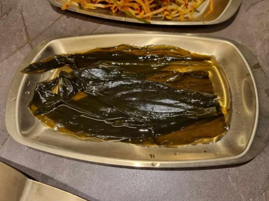 Myeongi namul and kimchi served with the meat