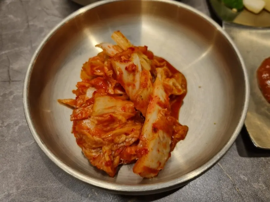 Table spread of banchan alongside the hanwoo