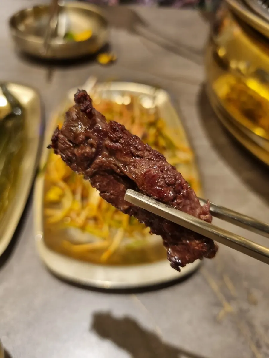 A piece of hanwoo eaten with pa muchim