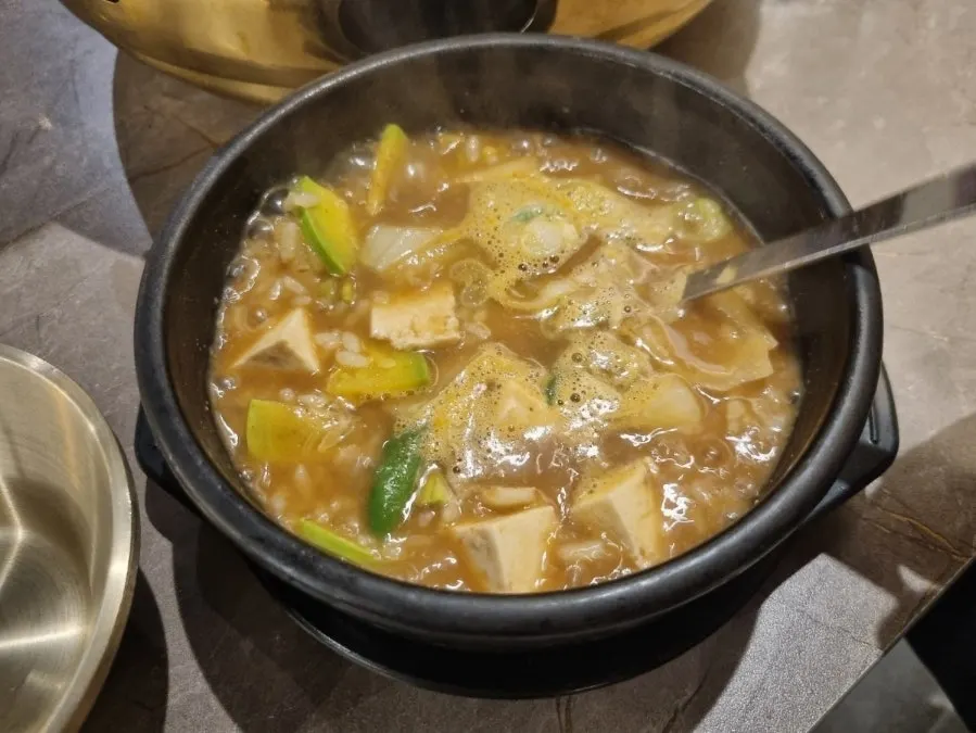Pot of complimentary doenjang sulbap