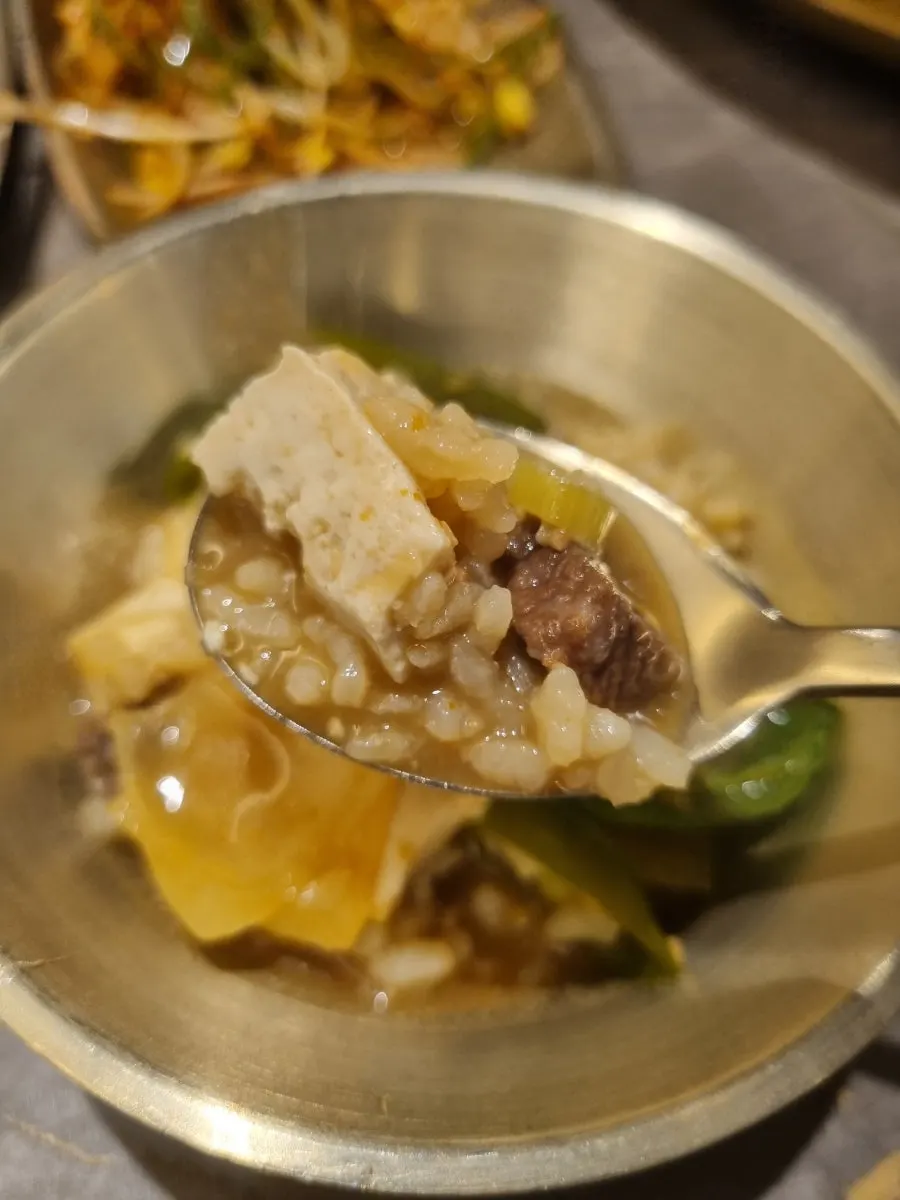 Scooping out the doenjang sulbap