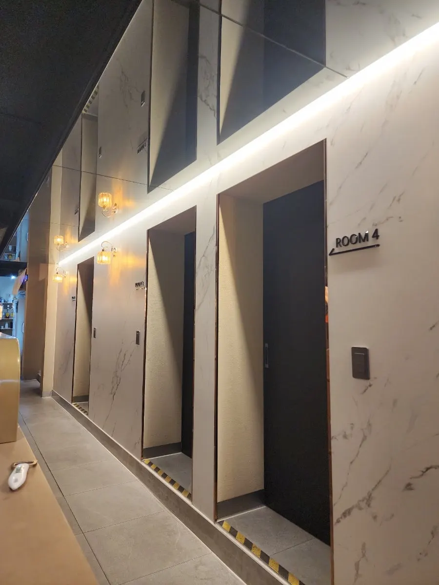 Corridor divided into private rooms by partitions