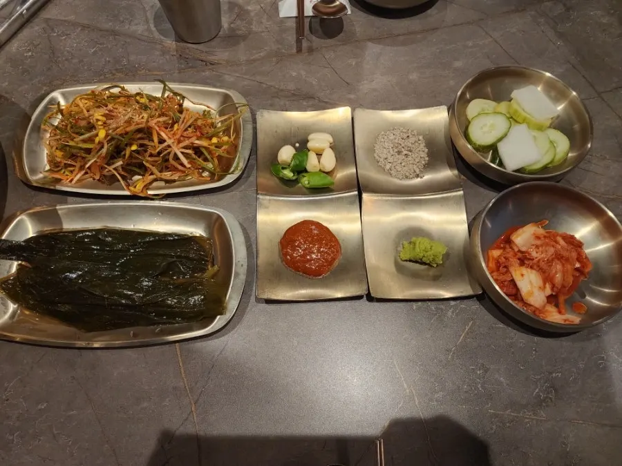 Basic side dishes served in brass bowls